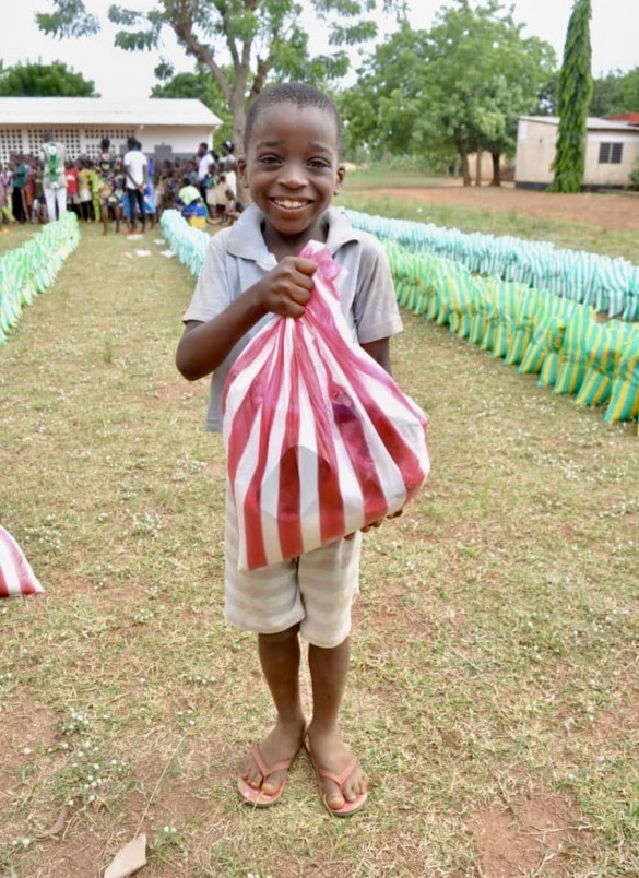 Child with bag of food